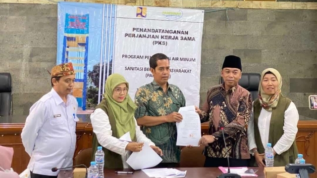 Badan Perencanaan Pembangunan Daerah (Bappeda) Kabupaten Bangkalan Saat Melakukan Penandatanganan Perjanjian Kerja Sama.