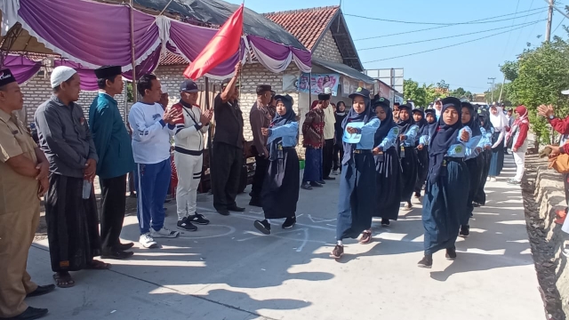 Gerak Jalan Yang Digelar Di Desa Banjar Talela Kecamatan Camplong.