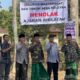 Masyarakat Dan Kepala Desa Saat Melakukan Pemasangan Banner Penolakan Ajaran Khilafah.