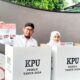 Bupati Sumenep Bersama Istri Saat Menggunakan Hak Pilihnya.